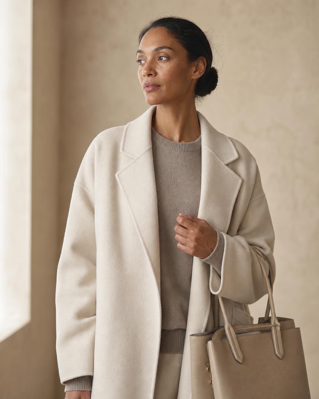 Customer photo: bone wool coat with the Aura Tote in crisp beige