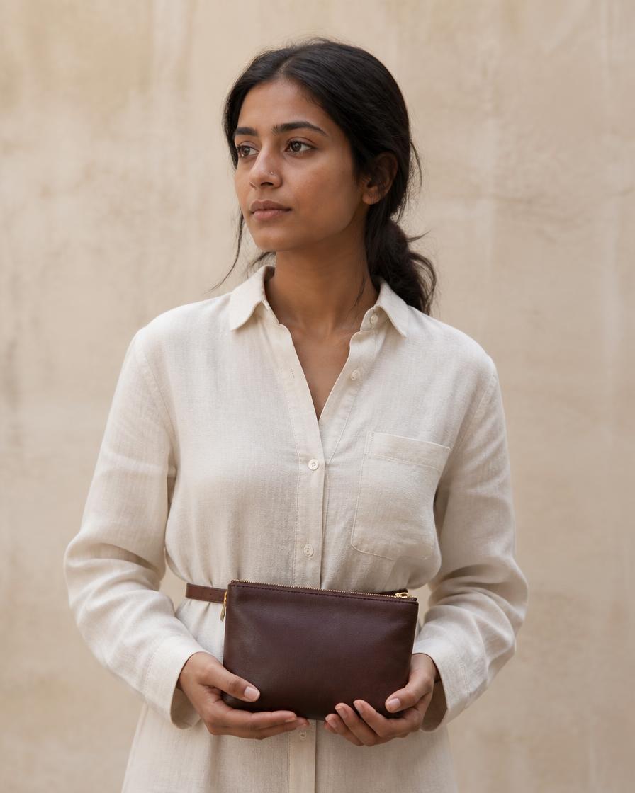 Model carrying The Hearth Pouch, small pouch, four colours